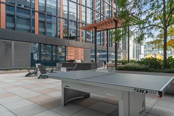 rooftop social area with ping pong at Via Seaport apartments